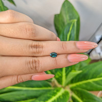 0.83 Ct. Bluish Green Sapphire from Madagascar Life Style