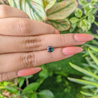 0.87 Ct. Bluish Green Sapphire from Madagascar Life Style
