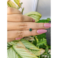 0.89 Ct. Bluish Green Sapphire from Madagascar Life Style