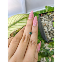 0.86 Ct. Bluish Green Sapphire from Madagascar Life Style