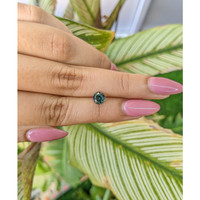0.92 Ct. Bluish Green Sapphire from Madagascar Life Style