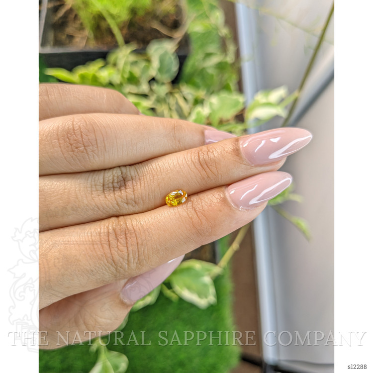 0.72 Ct. Orangish Yellow Sapphire from Ceylon (Sri Lanka)