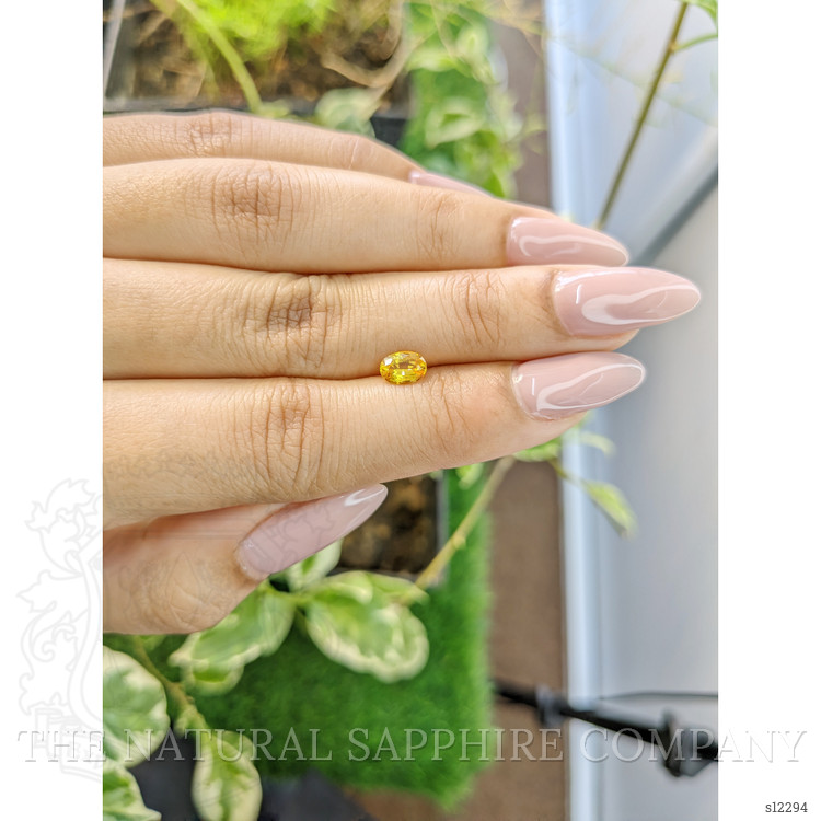 0.67 Ct. Orangish Yellow Sapphire from Ceylon (Sri Lanka)
