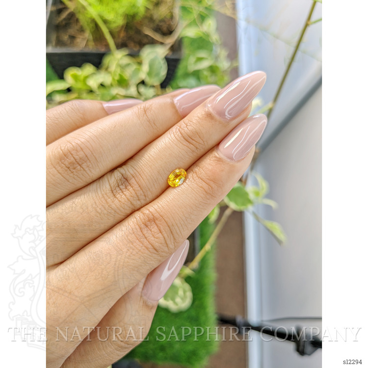 0.67 Ct. Orangish Yellow Sapphire from Ceylon (Sri Lanka)