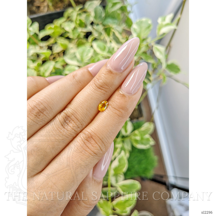 0.60 Ct. Orangish Yellow Sapphire from Ceylon (Sri Lanka)