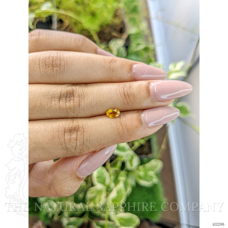 0.60 Ct. Orangish Yellow Sapphire from Ceylon (Sri Lanka)