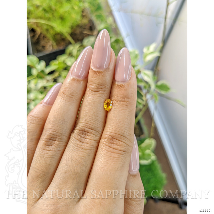 0.60 Ct. Orangish Yellow Sapphire from Ceylon (Sri Lanka)