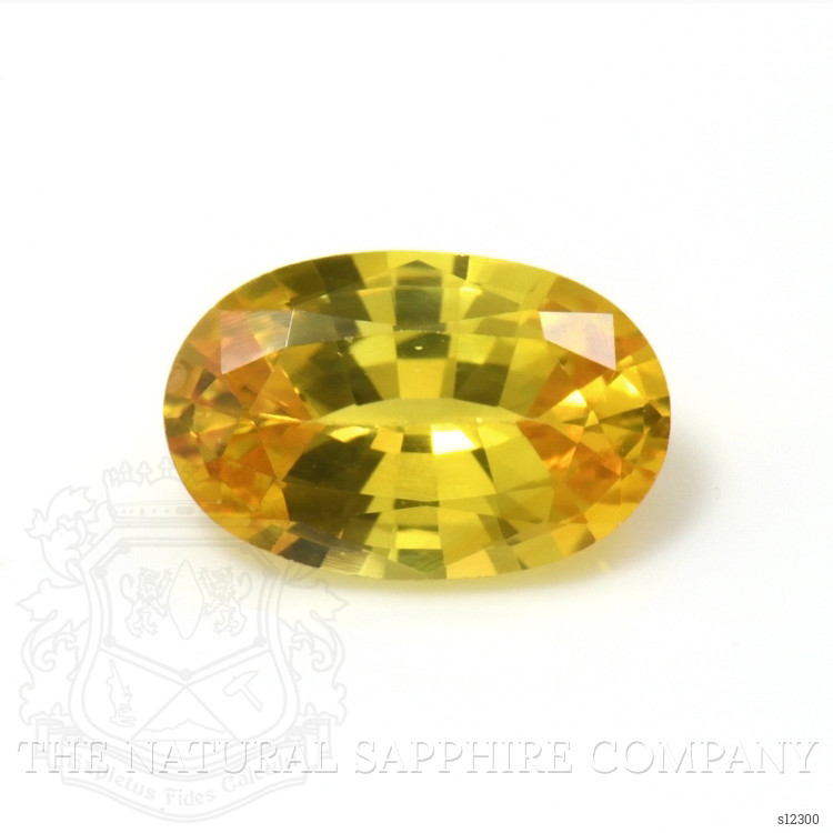 0.56 Ct. Orangish Yellow Sapphire from Ceylon (Sri Lanka)