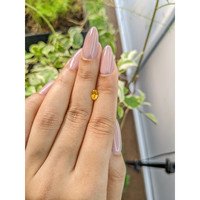 0.65 Ct. Orangish Yellow Sapphire from Ceylon (Sri Lanka) Life Style