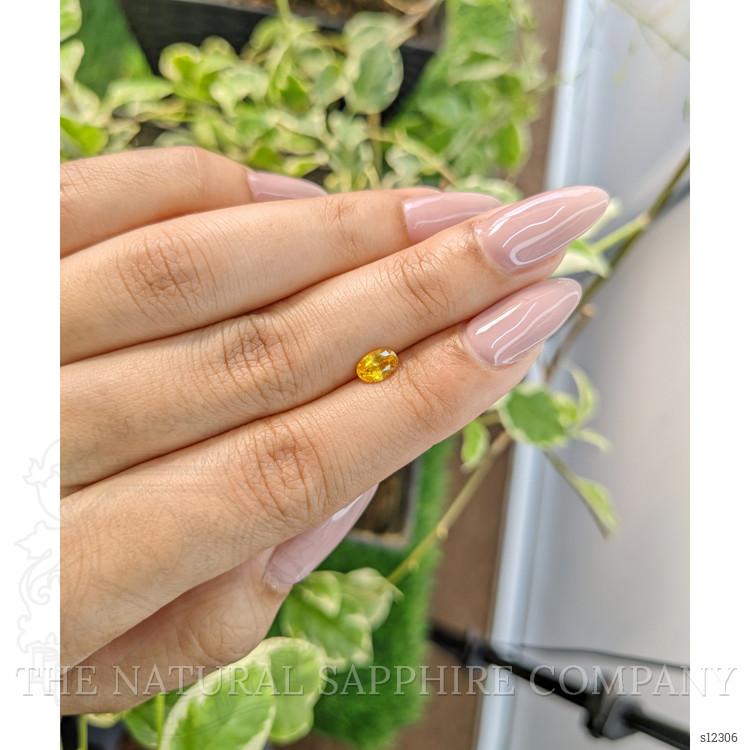 0.65 Ct. Orangish Yellow Sapphire from Ceylon (Sri Lanka)