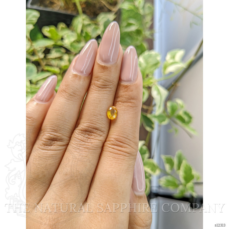 0.87 Ct. Yellowish Orange Sapphire from Ceylon (Sri Lanka)