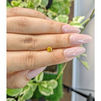 0.44 Ct. Orangish Yellow Sapphire from Ceylon (Sri Lanka) Life Style