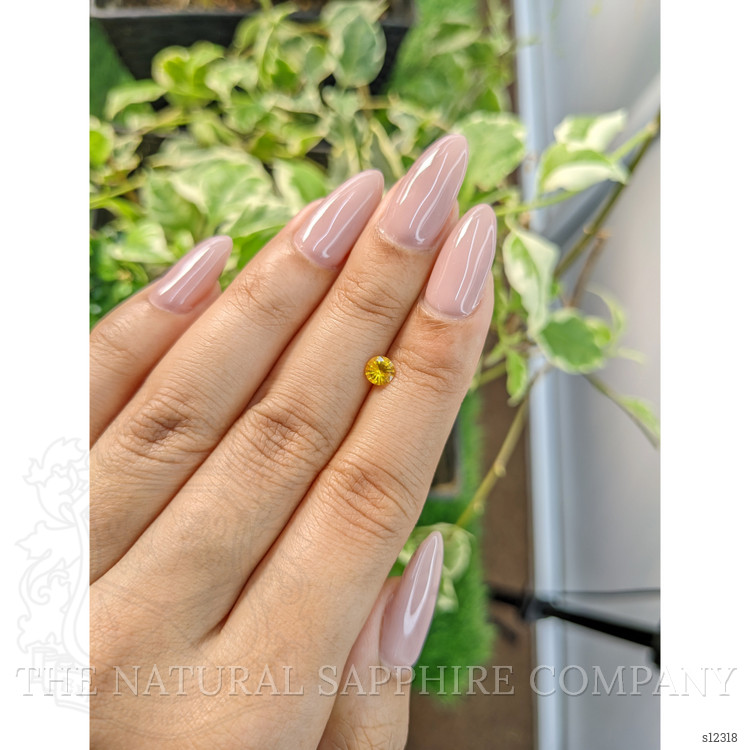 0.44 Ct. Orangish Yellow Sapphire from Ceylon (Sri Lanka)