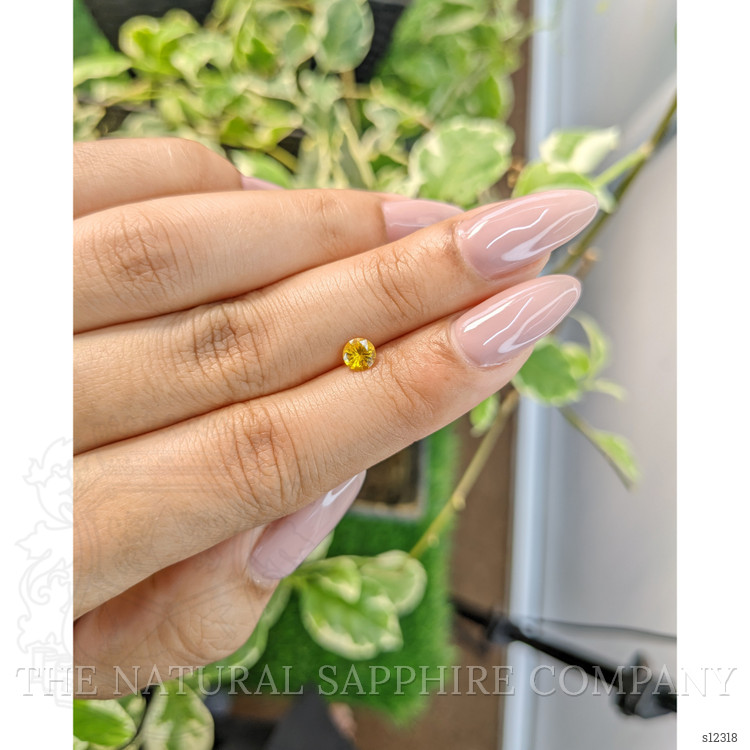 0.44 Ct. Orangish Yellow Sapphire from Ceylon (Sri Lanka)
