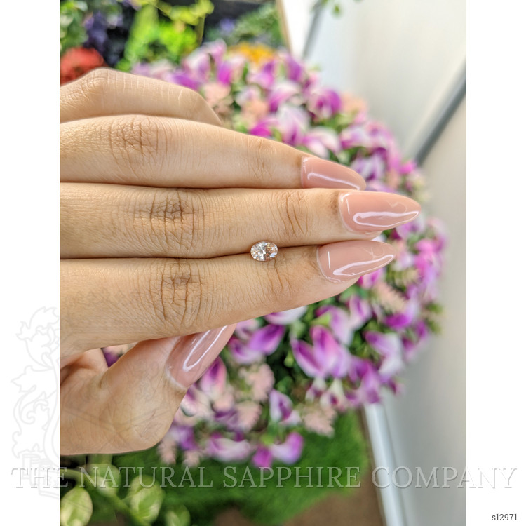 0.61 Ct. Peach Sapphire from Ceylon (Sri Lanka)