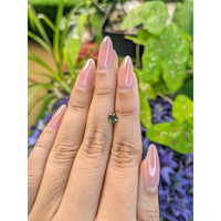0.64 Ct. Yellowish Green Sapphire from Madagascar Life Style