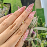 0.80 Ct. Yellowish Orange Sapphire from Ceylon (Sri Lanka) Life Style