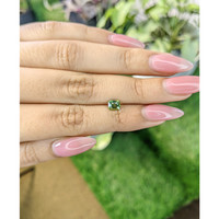 0.81 Ct. Yellowish Green Sapphire from Madagascar Life Style