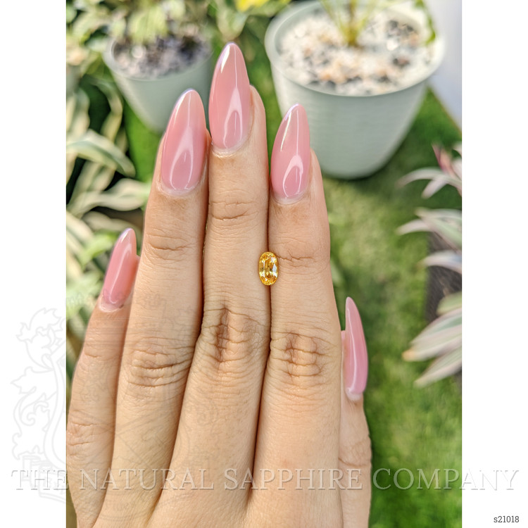 0.87 Ct. Orangish Yellow Sapphire from Ceylon (Sri Lanka)