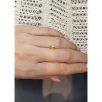 0.82 Ct. Greenish Yellow Sapphire from Madagascar Life Style