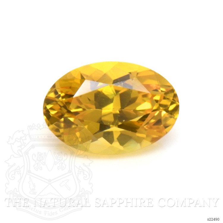 0.59 Ct. Orangish Yellow Sapphire from Ceylon (Sri Lanka)
