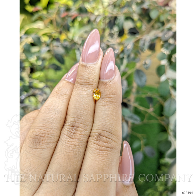 0.54 Ct. Orangish Yellow Sapphire from Ceylon (Sri Lanka)