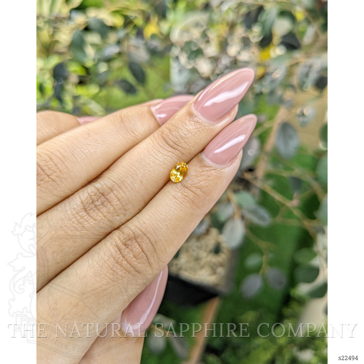 0.54 Ct. Orangish Yellow Sapphire from Ceylon (Sri Lanka)