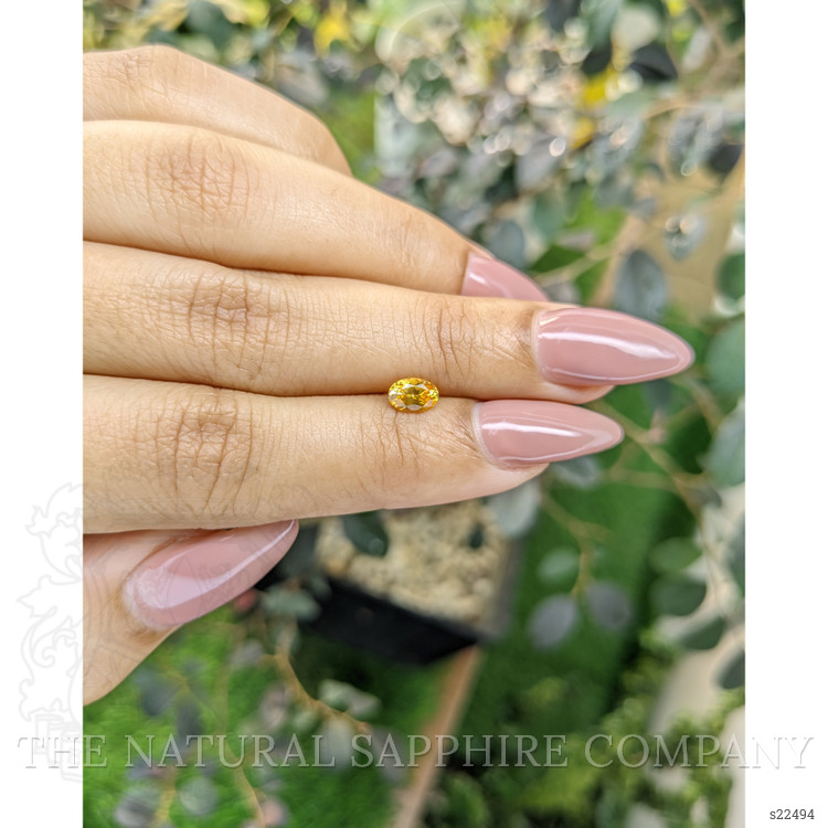 0.54 Ct. Orangish Yellow Sapphire from Ceylon (Sri Lanka)