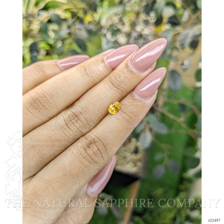 0.75 Ct. Orangish Yellow Sapphire from Ceylon (Sri Lanka)