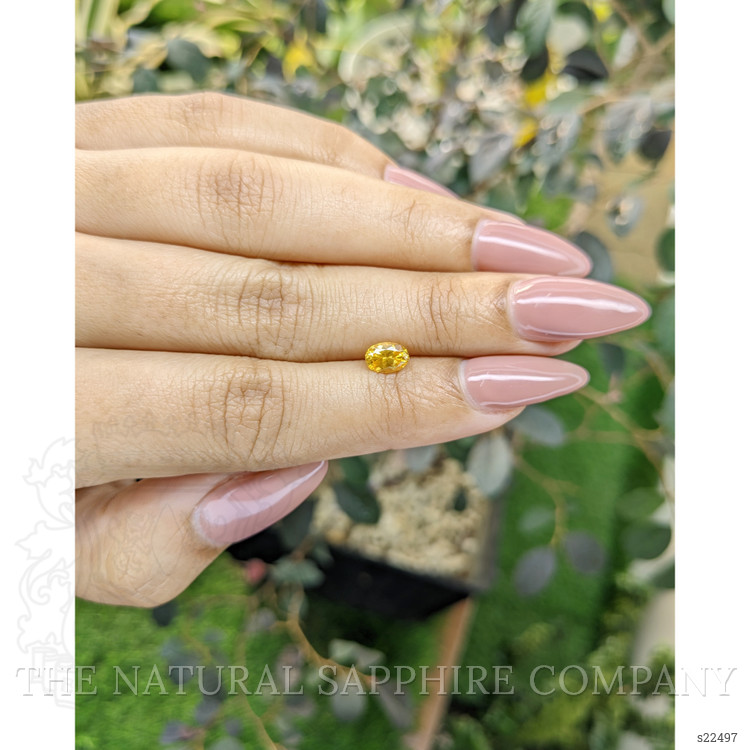 0.75 Ct. Orangish Yellow Sapphire from Ceylon (Sri Lanka)