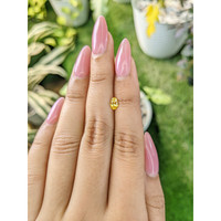 0.54 Ct. Orangish Yellow Sapphire from Ceylon (Sri Lanka) Life Style