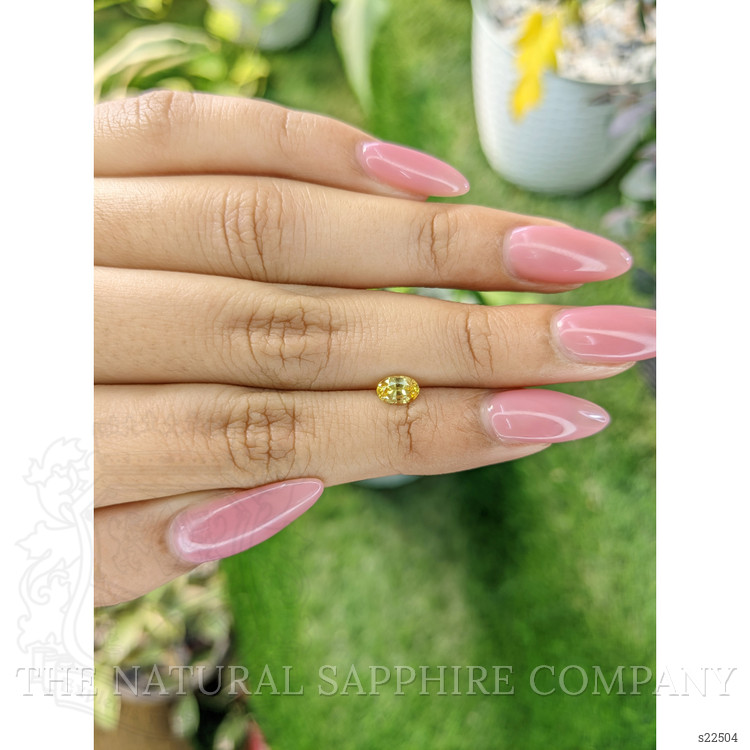 0.60 Ct. Orangish Yellow Sapphire from Ceylon (Sri Lanka)