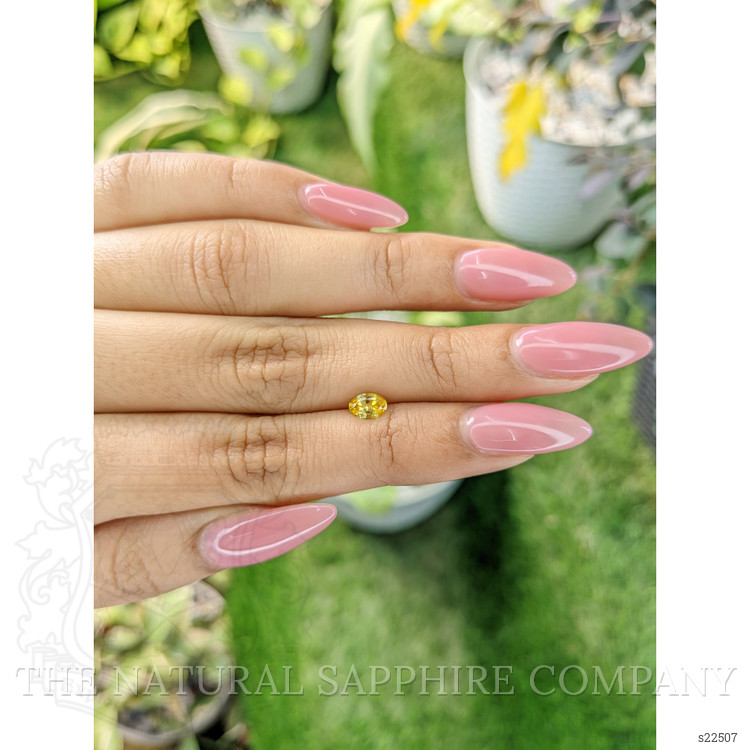 0.45 Ct. Orangish Yellow Sapphire from Ceylon (Sri Lanka)