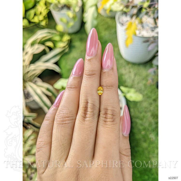 0.45 Ct. Orangish Yellow Sapphire from Ceylon (Sri Lanka)