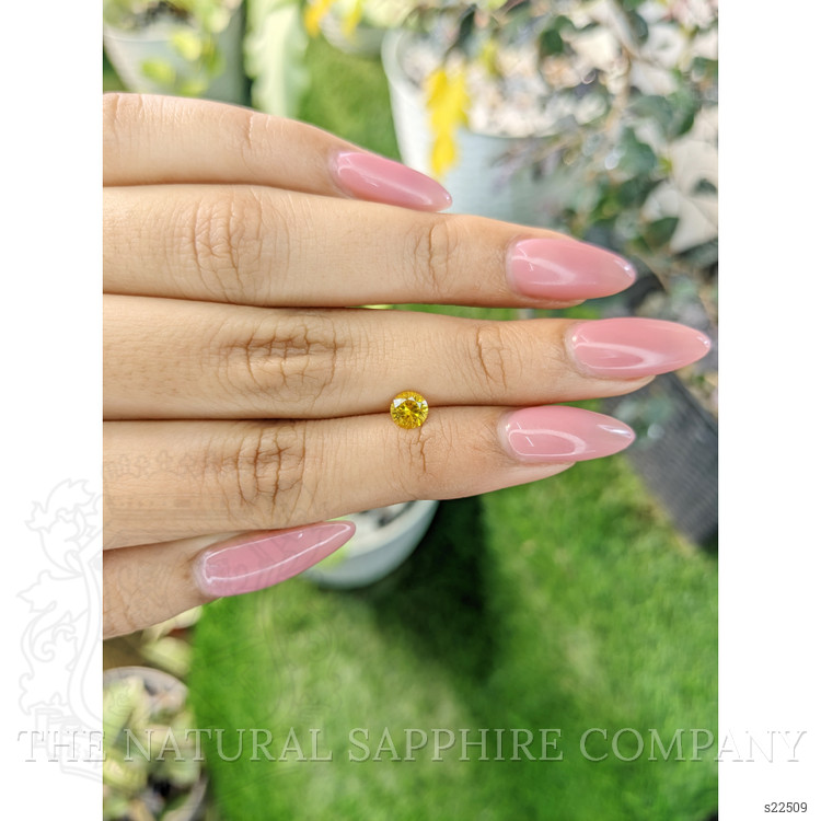 0.58 Ct. Orangish Yellow Sapphire from Ceylon (Sri Lanka)