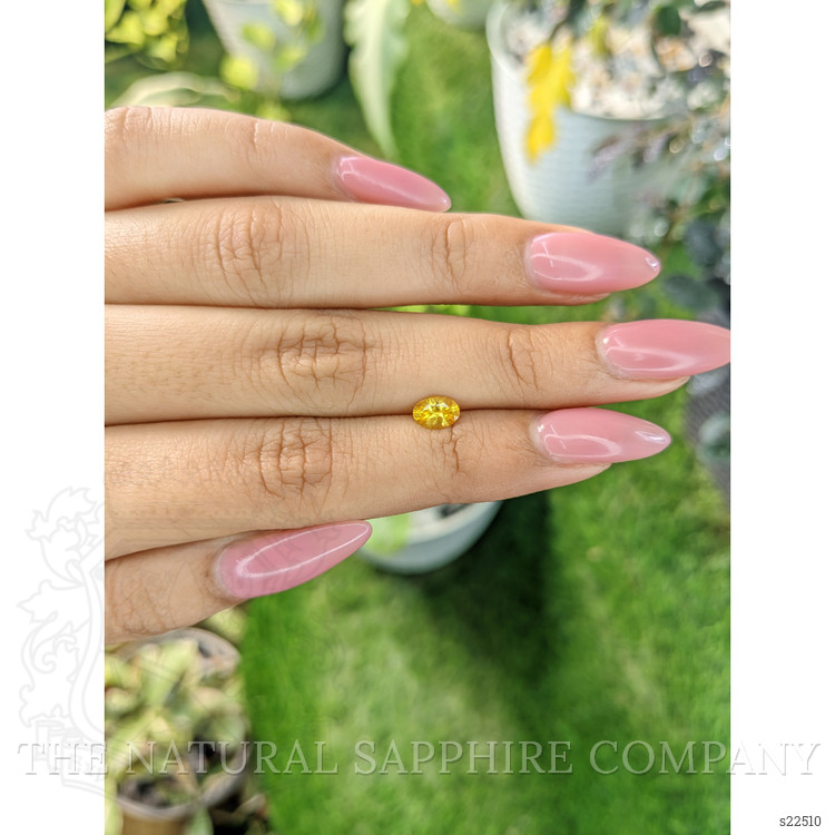 0.60 Ct. Orangish Yellow Sapphire from Ceylon (Sri Lanka)