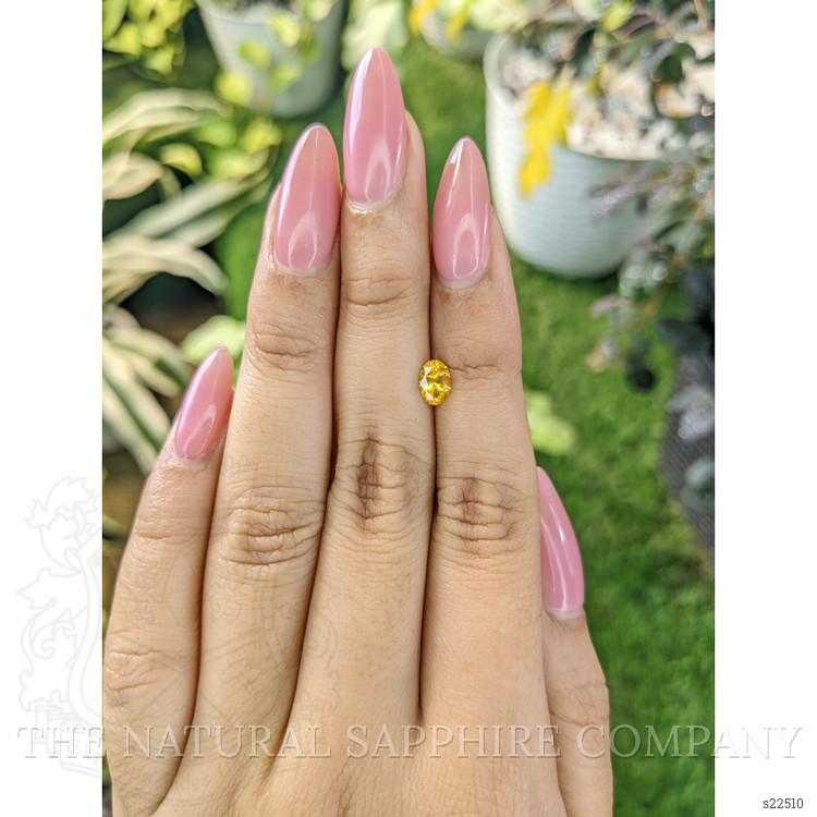 0.60 Ct. Orangish Yellow Sapphire from Ceylon (Sri Lanka)