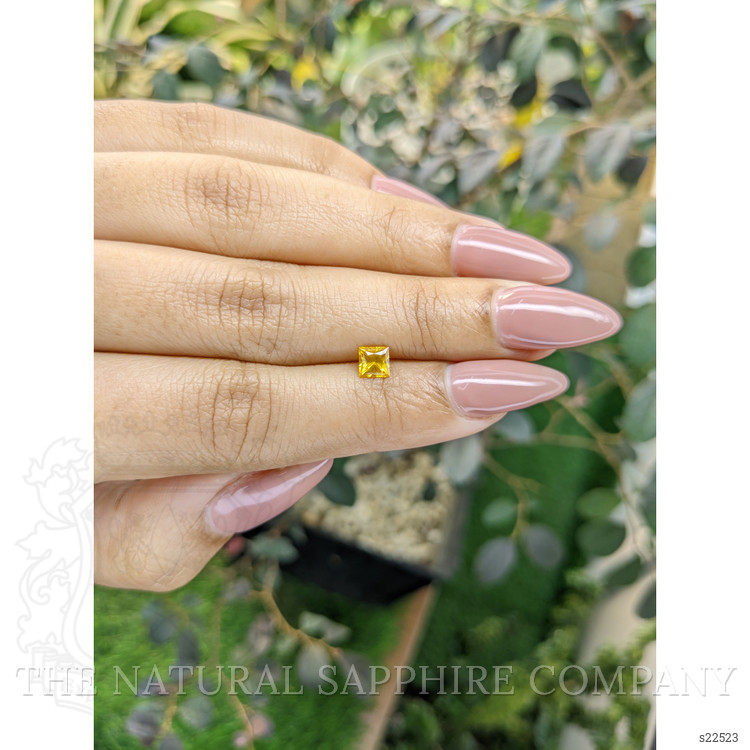 0.59 Ct. Orangish Yellow Sapphire from Ceylon (Sri Lanka)