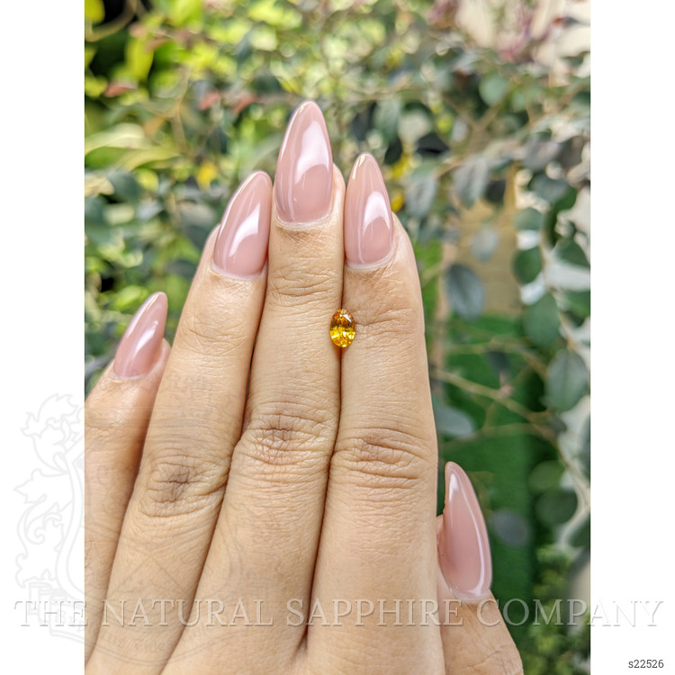 0.57 Ct. Orangish Yellow Sapphire from Ceylon (Sri Lanka)