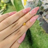 0.60 Ct. Yellowish Orange Sapphire from Ceylon (Sri Lanka) Life Style