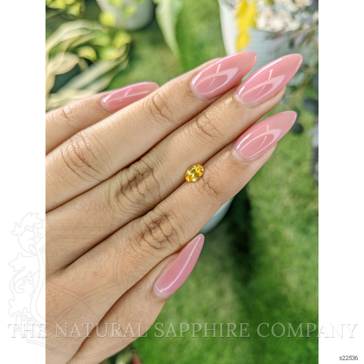 0.58 Ct. Orangish Yellow Sapphire from Ceylon (Sri Lanka)