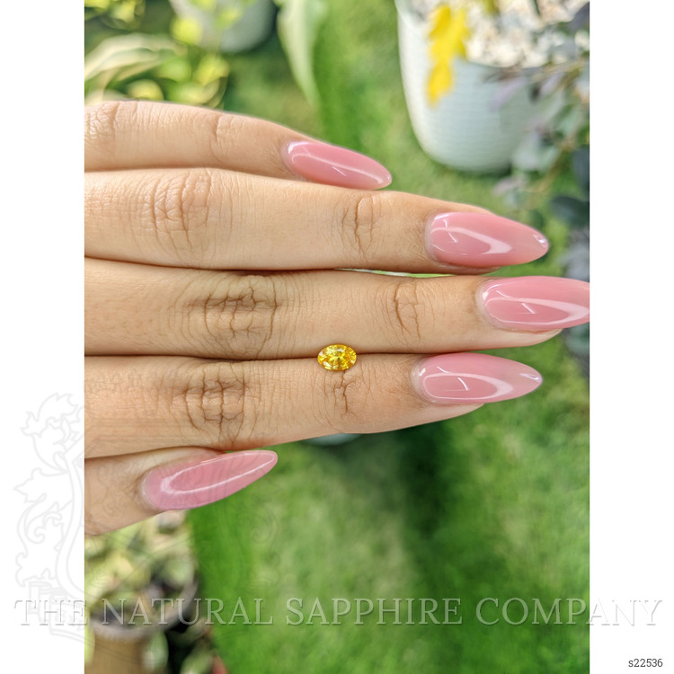 0.58 Ct. Orangish Yellow Sapphire from Ceylon (Sri Lanka)