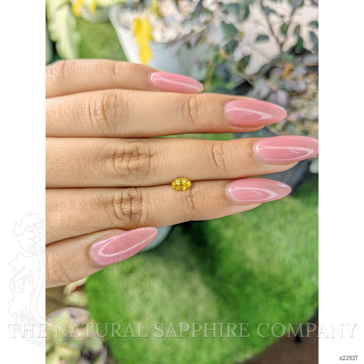 0.49 Ct. Orangish Yellow Sapphire from Ceylon (Sri Lanka)