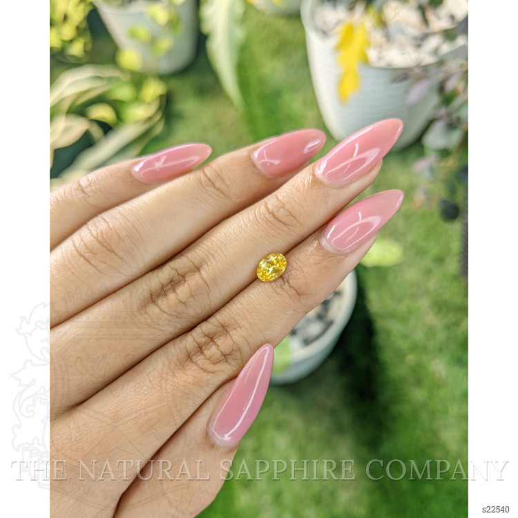 0.84 Ct. Orangish Yellow Sapphire from Ceylon (Sri Lanka)