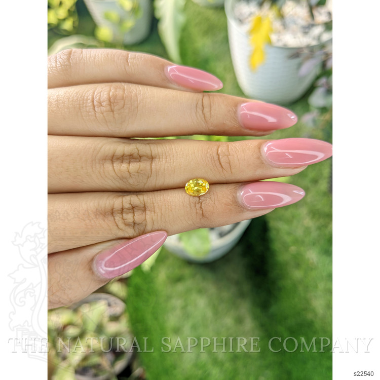 0.84 Ct. Orangish Yellow Sapphire from Ceylon (Sri Lanka)