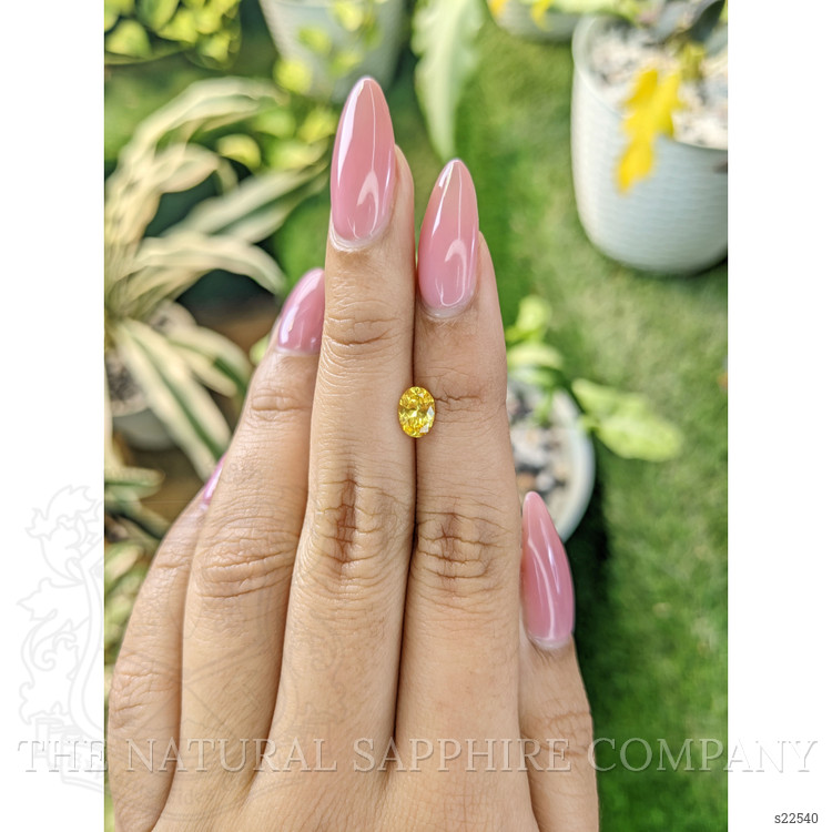 0.84 Ct. Orangish Yellow Sapphire from Ceylon (Sri Lanka)