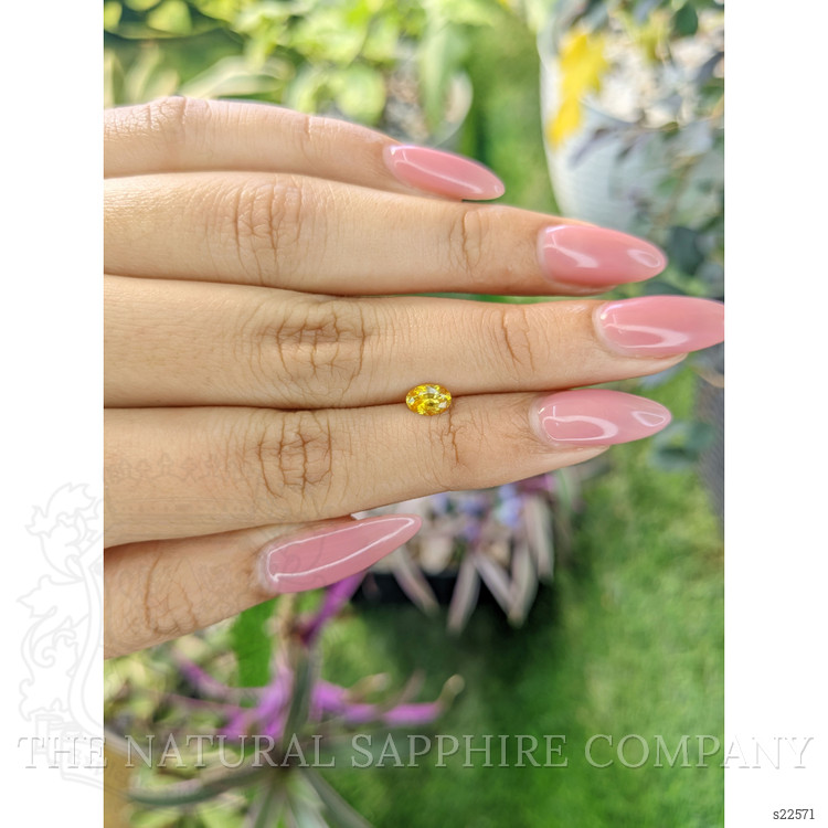 0.51 Ct. Orangish Yellow Sapphire from Ceylon (Sri Lanka)