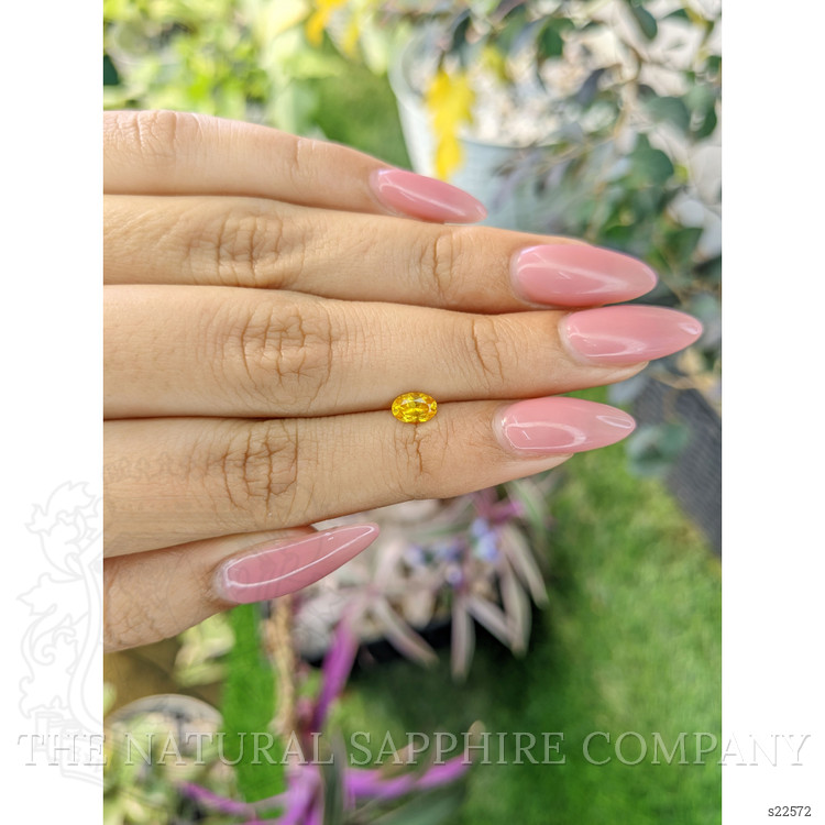 0.54 Ct. Orangish Yellow Sapphire from Ceylon (Sri Lanka)