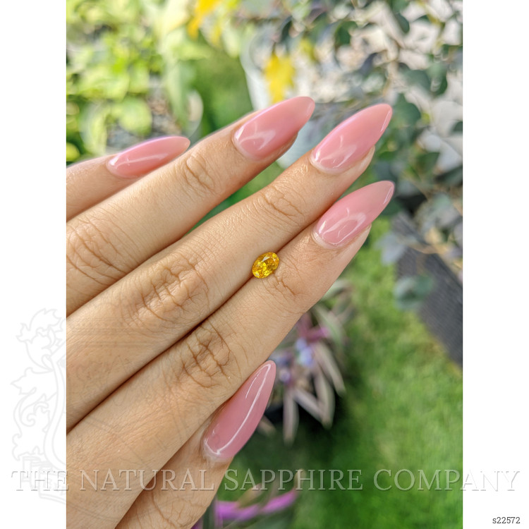 0.54 Ct. Orangish Yellow Sapphire from Ceylon (Sri Lanka)