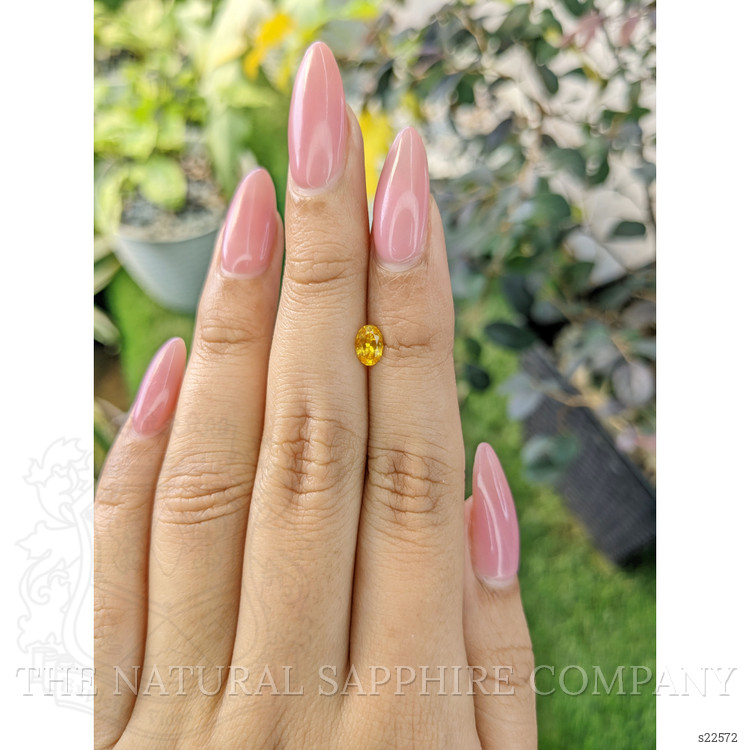 0.54 Ct. Orangish Yellow Sapphire from Ceylon (Sri Lanka)